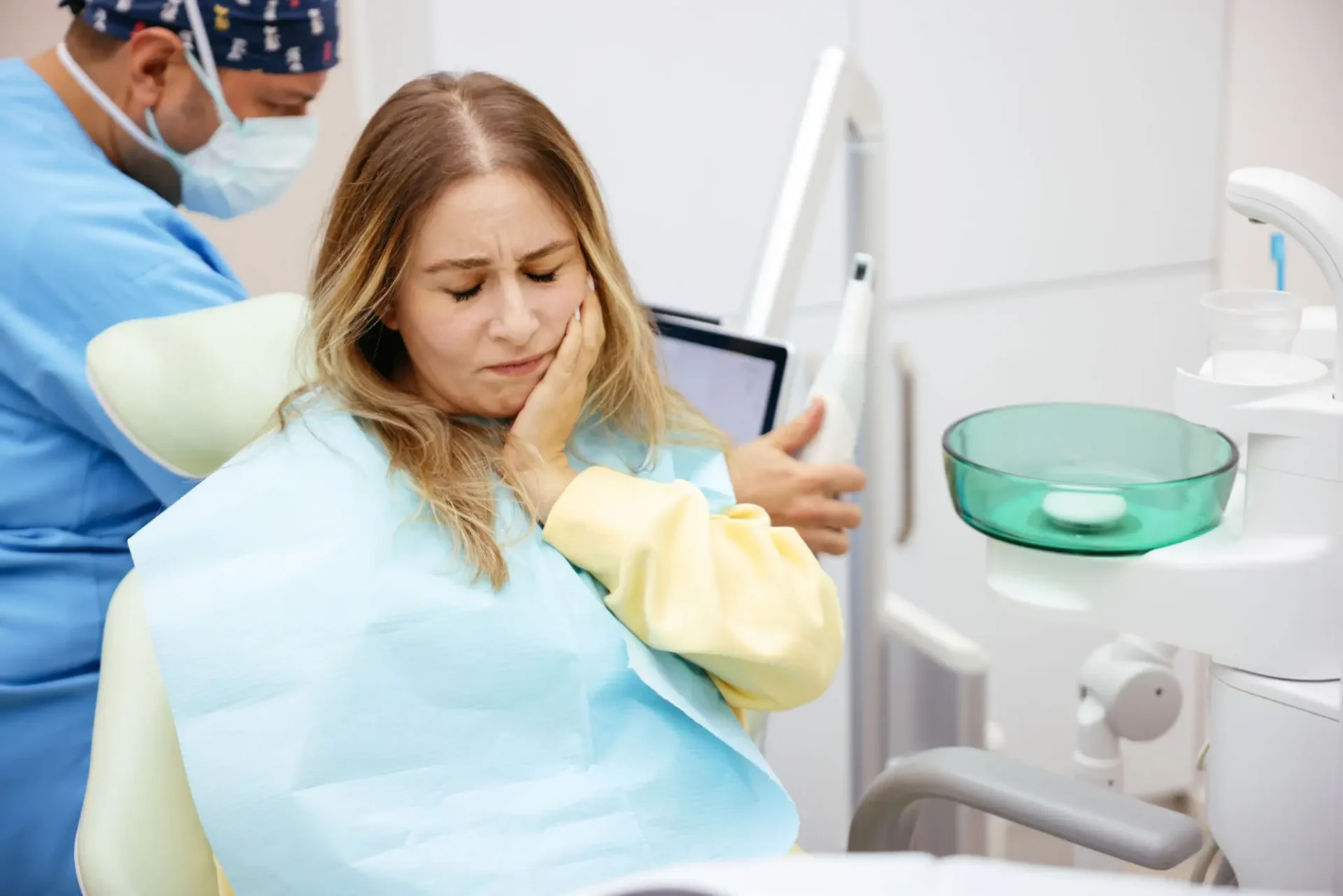 Woman in dental chair with toothache