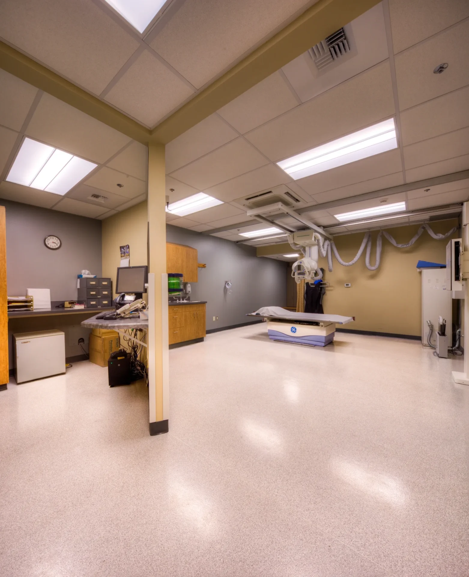 Empty medical imaging room with X-ray table